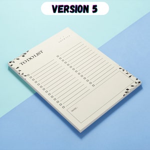 May include: A white to-do list notepad with black floral accents and a black "TO DO LIST" title. The notepad has a section for notes and a column for writing down tasks.