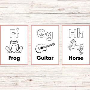 May include: Three printable flashcards with black and white illustrations. The first card features the letter F and a frog, the second card features the letter G and a guitar, and the third card features the letter H and a horse. Each card has the letter and the word for the illustration written in black.