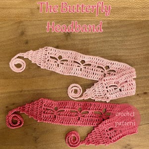 May include: Two handmade crochet headbands in shades of pink. The headbands feature a butterfly design and are displayed on a wooden surface. The text "The Butterfly Headband" is above the headbands. The text "crochet pattern" is on one of the headbands.