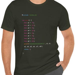 May include: A dark green t-shirt with code printed on it. The code includes the text "#include <stdio.h>" and "int main() { ... }" and uses the C programming language.