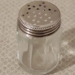 Antique Sterling Silver lid and glass  pepper pot .