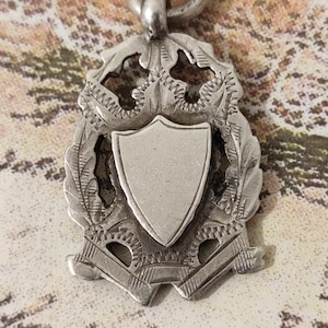 Antique Fob, Solid Silver. With blank Cartouche.