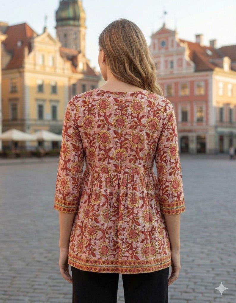 Women wearing a cotton printed kurti with floral ethnic design, featuring 34 sleeves and a comfortable relaxed fit. Lightweight breathable cotton fabric ideal for summer wear, casual outings, office wear, and daily use. Stylish Indian ethnic tunic paired with leggings, perfect for modern women who love traditional fashion.
Cotton printed women’s kurti with floral ethnic design, soft breathable fabric, 3/4 sleeves, comfortable fit. Ideal for casual wear, office use, summer styling,