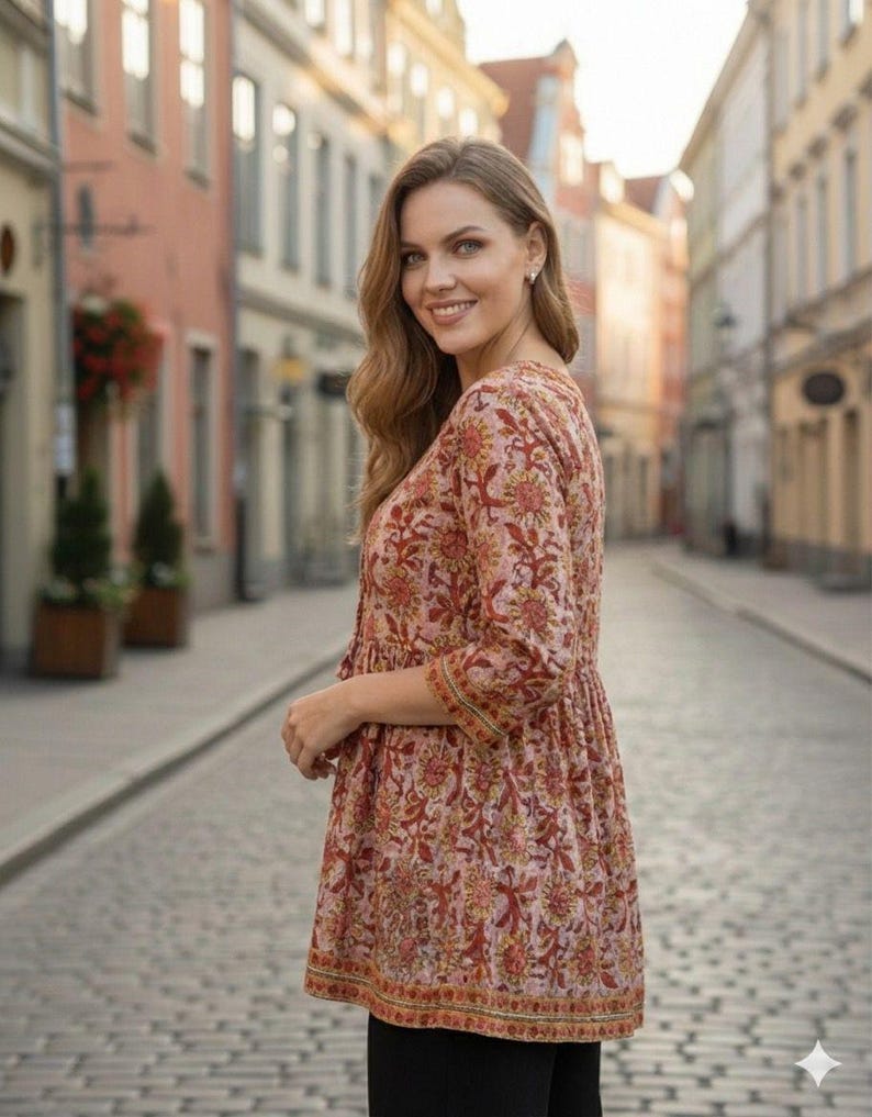 Women wearing a cotton printed kurti with floral ethnic design, featuring 34 sleeves and a comfortable relaxed fit. Lightweight breathable cotton fabric ideal for summer wear, casual outings, office wear, and daily use. Stylish Indian ethnic tunic paired with leggings, perfect for modern women who love traditional fashion.
Cotton printed women’s kurti with floral ethnic design, soft breathable fabric, 3/4 sleeves, comfortable fit. Ideal for casual wear, office use, summer styling,