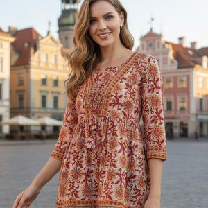 Women wearing a cotton printed kurti with floral ethnic design, featuring 34 sleeves and a comfortable relaxed fit. Lightweight breathable cotton fabric ideal for summer wear, casual outings, office wear, and daily use. Stylish Indian ethnic tunic paired with leggings, perfect for modern women who love traditional fashion.
Cotton printed women’s kurti with floral ethnic design, soft breathable fabric, 3/4 sleeves, comfortable fit. Ideal for casual wear, office use, summer styling,