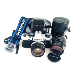 Olympus OM10 | Restored, Cleaned and Working | 50mm Olympus lens | 135mm Olympus lens | Vintage leather Olympus case | Vintage Olympus strap