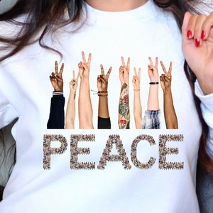 Friedenszeichen-Sweatshirt, verschiedene Hände Design, bequeme Statement-Kleidung, perfektes Geschenk für Unterstützer des Weltfriedens