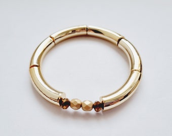 Trendy 80s gold bangle bracelet for women, curved tube beads in elastic acrylic, 80's retro vintage