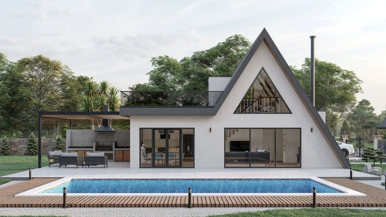 May include: A modern, white, A-frame house with a large, triangular window and a swimming pool in front. The house has a black roof and a wooden deck surrounding the pool.