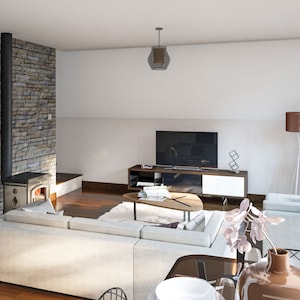 May include: A modern living room with a white sectional sofa, a coffee table, a television, a wood-burning stove, and a large window. The room has a light and airy feel with a stone wall and wood floors.