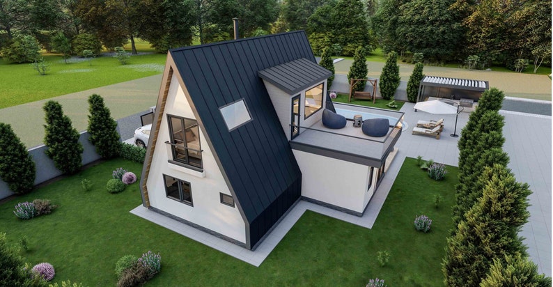 May include: A white and black modern A-frame house with a flat roof and a small deck. The house has large windows and a black metal roof. The house is surrounded by green grass and trees.