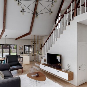 May include: A modern living room with a white and gray color scheme. The room features a large gray sectional sofa, a coffee table, a TV stand with a flat-screen TV, and a set of stairs leading to an upper level. The room has large windows that let in natural light.