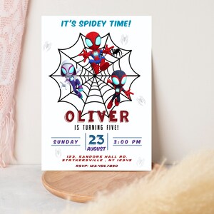 May include: A Spiderman-themed birthday party invitation with a red, black, and white cartoon Spiderman character on a web. The invitation says "It's Spidey Time!" and "Oliver is turning five!" with the date and time of the party.