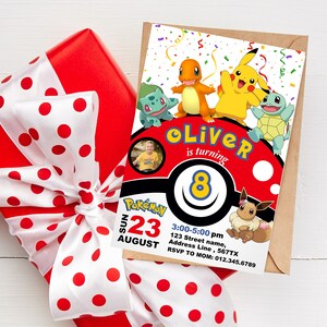 May include: A red and white polka dot gift box with a white ribbon. The box is tied with a bow. The box is sitting on a white surface. A Pokemon themed invitation card is on top of the box. The card features a red and white Pokeball with the text "Oliver is turning 8" and a picture of a boy. The card also features images of Pokemon characters, including Pikachu, Charmander, Bulbasaur, and Squirtle. The card has the text "Pokemon 23 August 3:00-5:00 pm 123 Street name, Address Line, 567TX RSVP TO MOM: 012.345.6789".