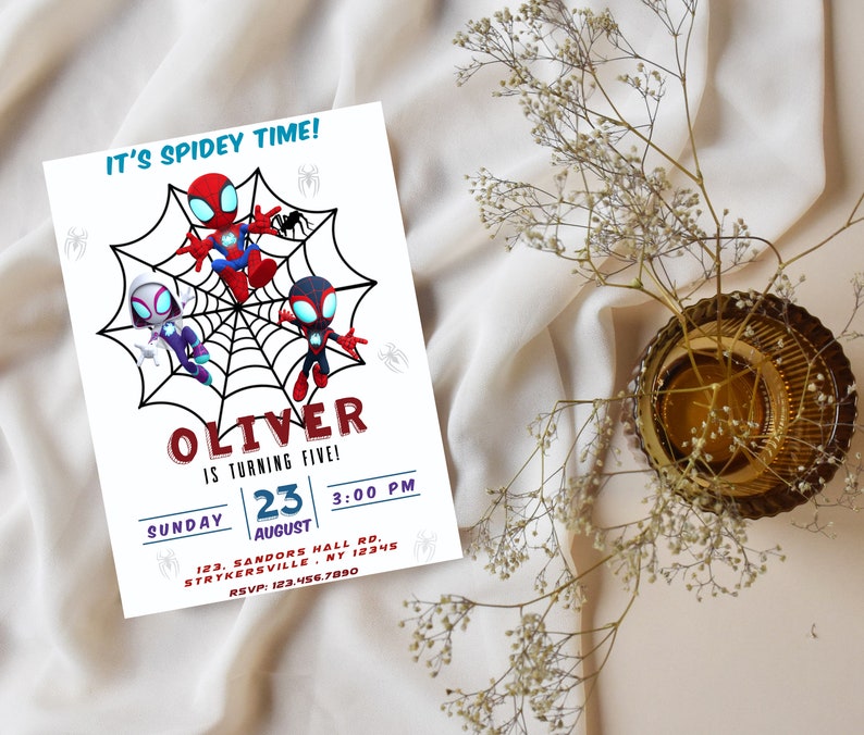 May include: A colorful invitation for a child's birthday party featuring a Spiderman theme. The invitation has a red, blue, and black color scheme and features three Spiderman characters. The text on the invitation reads "It's Spidey Time! Oliver is turning five! Sunday, August 23, 3:00 PM, 123 Sandors Hall Rd, Strykersville, NY 12345, RSVP: 123.456.7890."