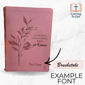 May include: A pink devotional Bible with floral accents and the text "Everyday Devotional Bible for Women." The cover features the name "Itzel Pinto" and the NLT logo. The upper right corner has the text "Lasting Script."