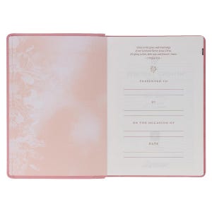 May include: Open pink journal with floral design on the left page and text on the right. The right page includes the words "Spiritual Growth" and prompts for "Presented to," "By," "On the occasion of," and "Date."