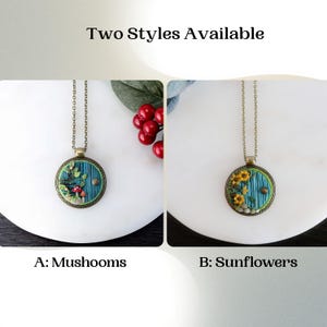 May include: Two pendant necklaces with bronze chains. One pendant features a blue door with mushrooms, the other a blue door with sunflowers. The text reads "Two Styles Available", "A: Mushrooms", and "B: Sunflowers".