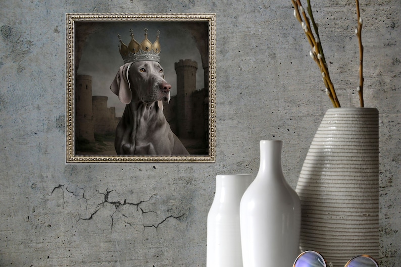 May include: A framed portrait of a Weimaraner dog wearing a gold crown, set against a backdrop of a medieval castle.