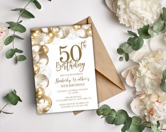 May include: A white invitation card with gold text and gold and white balloons, celebrating a 50th birthday. The card includes event details and is accompanied by a brown envelope and floral decorations.
