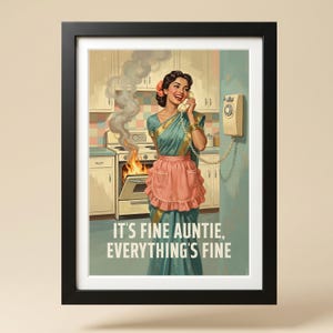 May include: A framed wall art print featuring a person in a teal sari and pink apron talking on a wall-mounted telephone while a kitchen oven behind them emits smoke and flames. The text reads: IT'S FINE AUNTIE, EVERYTHING'S FINE.
