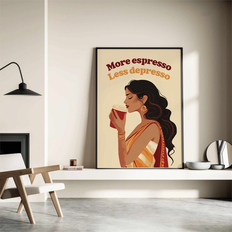 May include: A framed wall art print featuring an illustration of a person with long dark hair wearing gold jewelry and a draped garment, holding a red coffee cup. The text "More espresso Less depresso" is printed in dark red and orange above.