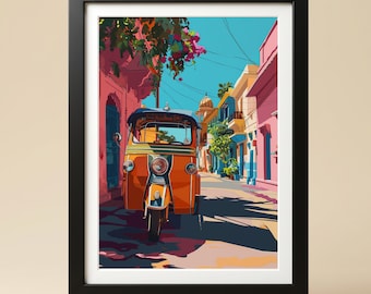 May include: A framed art print featuring a vibrant illustration of an orange auto rickshaw parked on a sunlit street. The scene includes pink buildings, green foliage, and a clear blue sky, all enclosed within a simple black rectangular frame.