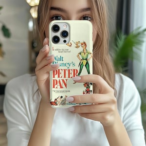 May include: A white iPhone case with a vintage Peter Pan movie poster design. The poster features a colorful illustration of Peter Pan flying with a sword, and the text "Walt Disney's Peter Pan" in red and black. The case also includes the text "It will live in your heart forever!" and "Technicolor."