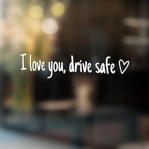 May include: A blurry image with the text "I love you, drive safe" and a heart symbol.