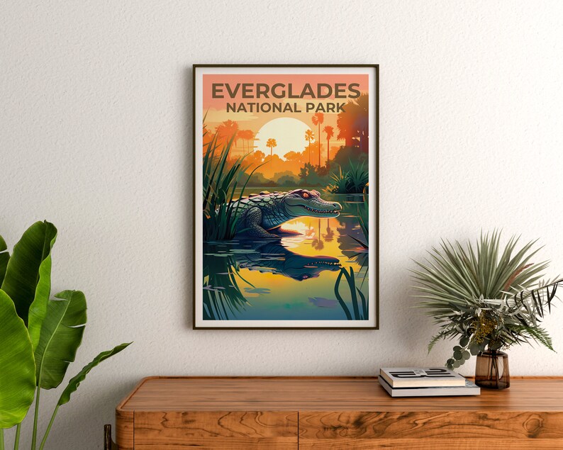 May include: A vintage-style poster with the text "Everglades National Park" in brown lettering. The poster features a green alligator swimming in a body of water with a sunset in the background.
