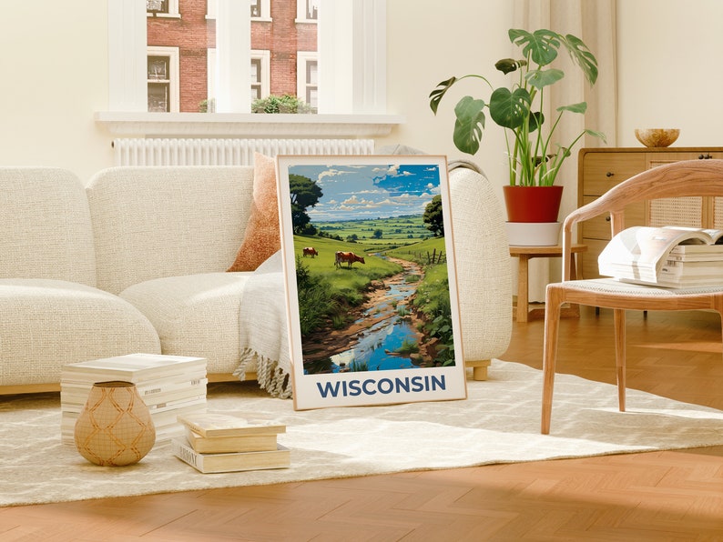 May include: A framed landscape print featuring a vibrant depiction of a Wisconsin countryside scene. The artwork showcases a flowing stream, green fields, and grazing cows under a blue sky. The word "WISCONSIN" is printed at the bottom.