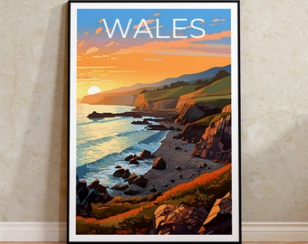 May include: A framed art print featuring a coastal landscape with the word "WALES" at the top. The scene depicts a sunset over the sea, with cliffs, green hills, and a rocky beach. The sky transitions from blue to orange.