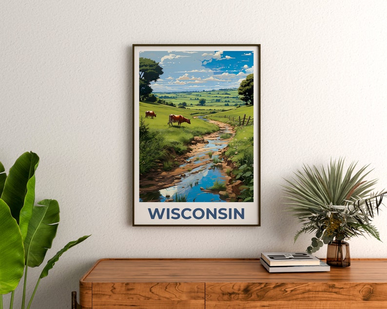 May include: A framed art print featuring a scenic landscape of Wisconsin. The artwork depicts a stream flowing through green fields, with cows grazing in the distance under a blue sky. The word "WISCONSIN" is printed in navy blue at the bottom.