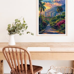 May include: A vintage travel poster with a cityscape of Caracas, Venezuela. The poster features a road leading up a hill with palm trees and lush greenery. The text "CARACAS VENEZUELA" is printed in blue at the top of the poster.