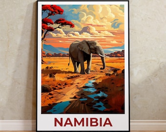 May include: A framed art print featuring an elephant walking on a dirt path in Namibia. The artwork showcases a vibrant sunset with orange, yellow, and blue hues. The word "NAMIBIA" is printed in red at the bottom.