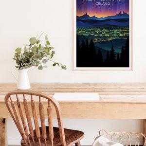 May include: A framed poster featuring a colourful illustration of a city skyline at night with the text "REYKJAVIK ICELAND" at the top.