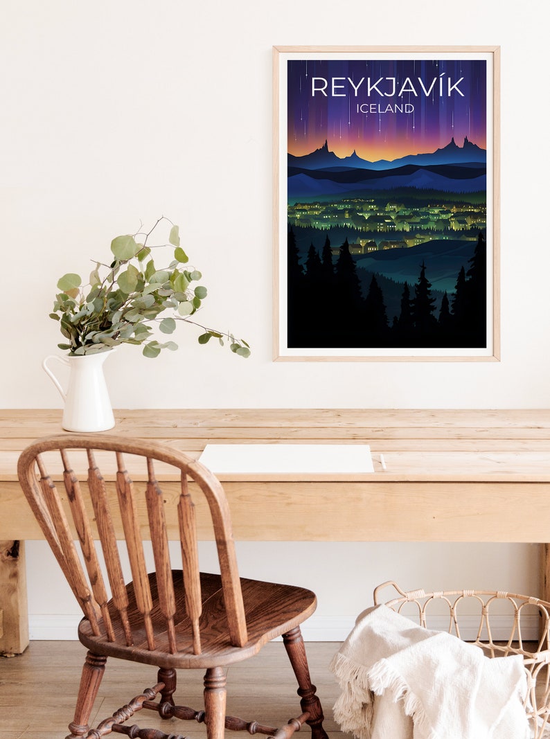 May include: A framed poster featuring a colourful illustration of a city skyline at night with the text "REYKJAVIK ICELAND" at the top.