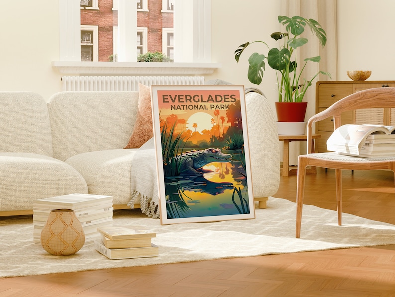 May include: A vintage-style poster with an illustration of an alligator in a swamp at sunset. The poster reads "Everglades National Park".
