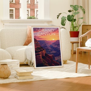 May include: A framed print of the Grand Canyon with a sunset in the background. The print is in a living room setting with a couch, chair, and plants.