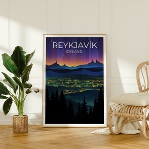 May include: A poster featuring a night-time cityscape of Reykjavik, Iceland. The poster has a dark blue background with a purple and orange gradient sky. The city is illuminated with yellow lights. The text "REYKJAVIK" and "ICELAND" is printed in white at the top of the poster.