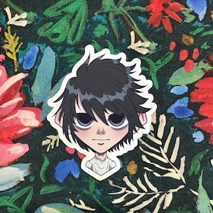 May include: A die-cut sticker featuring an anime-style character with black hair and large, light blue eyes. The character has a pale complexion and is wearing a white shirt. The sticker is set against a dark floral background with red, blue, and green accents.