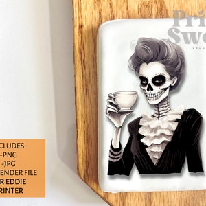 May include: A rectangular white image featuring a skeleton woman holding a teacup. She wears a black jacket with a ruffled collar. The image has the text "Print Sweet Studio" and "INCLUDES: -PNG -JPG -BARTENDER FILE FOR EDDIE PRINTER".