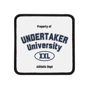 May include: White patch with black stitching around the edges. The patch has the text "Property of Undertaker University XXL Athletic Dept" in navy blue.