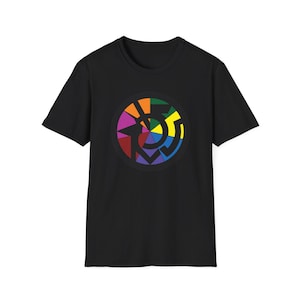 May include: Black t-shirt featuring a colourful circular design with a rainbow colour scheme. The design is a geometric pattern with a central circle and radiating lines.