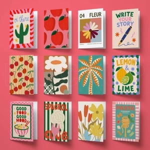 May include: A collection of twelve rectangular greeting cards arranged in a grid, featuring various colorful illustrations including a cactus, apples, flowers, a pen, cherries, a palm tree, citrus fruits, ramen, spaghetti, and pasta shapes with text.