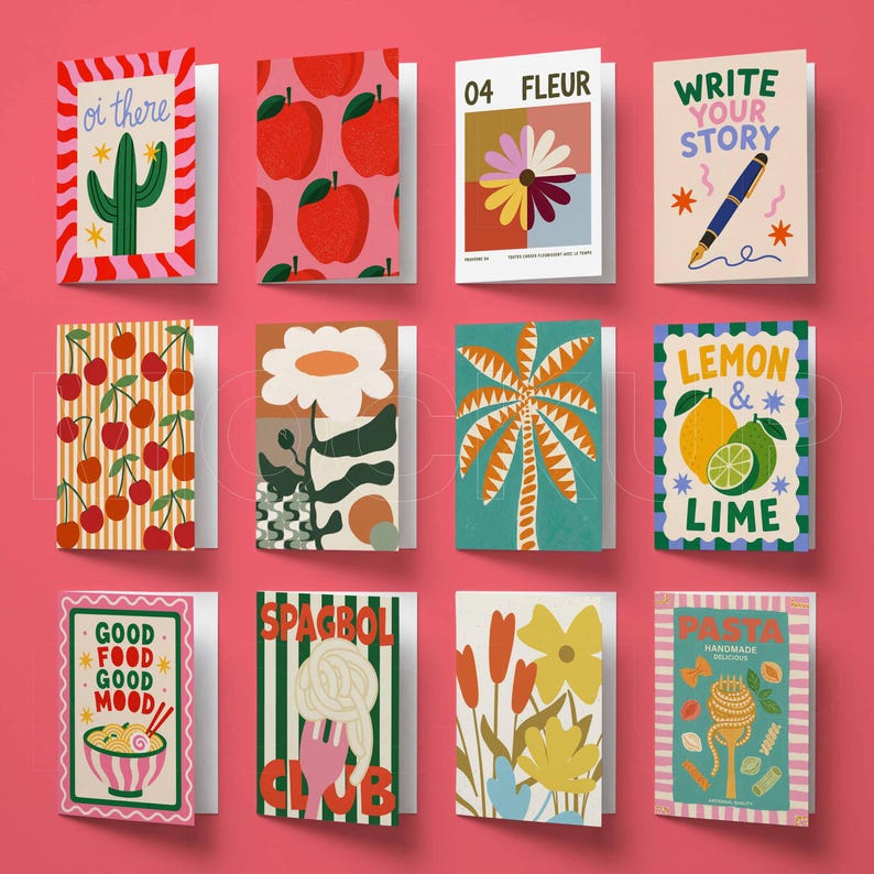 May include: A collection of twelve rectangular greeting cards arranged in a grid, featuring various colorful illustrations including a cactus, apples, flowers, a pen, cherries, a palm tree, citrus fruits, ramen, spaghetti, and pasta shapes with text.