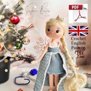 May include: Crochet pattern PDF for a blue and white princess doll with blonde hair and a crown. The pattern is in English and includes a UK flag.