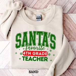 Santa&#39;s Favorite 4th Grade Teacher Sweatshirt: Christmas Holiday Apparel