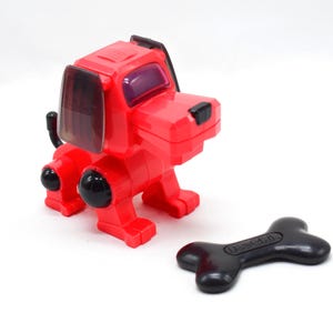 Vintage Poo-Chi-robothond rood en zwart miniatuurspeelgoed met bot (SEGA, 2000)