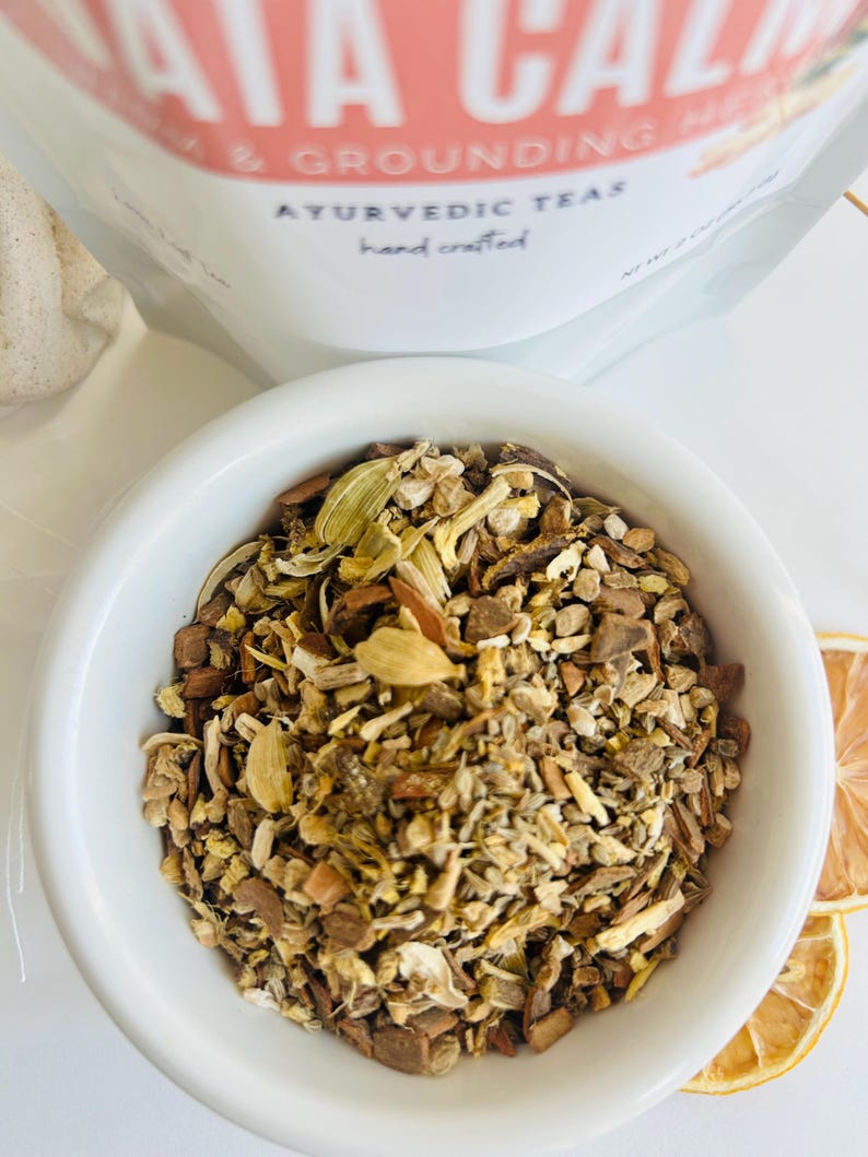 Close up of loose leaf herbal tea blend with dried botanicals in bowl, aromatic calming tea for relaxing evening routine and cozy tea moments